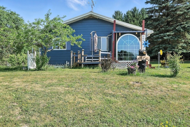 8698 Big Stone Lake Rd, Evart, MI 49631 - back of house with a yard