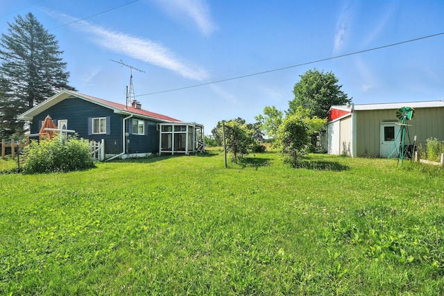 8698 Big Stone Lake Rd, Evart, MI 49631 - view of grassy yard with an outdoor structure and an outbuilding