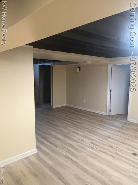 24890 Arden Park Dr, Farmington Hills, MI 48336 - finished basement featuring light wood-style floors and baseboards