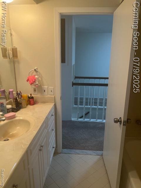 24890 Arden Park Dr, Farmington Hills, MI 48336 - bathroom featuring vanity, tile patterned flooring, and a bath
