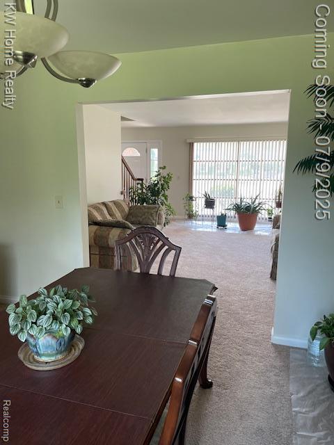 24890 Arden Park Dr, Farmington Hills, MI 48336 - carpeted dining room featuring baseboards