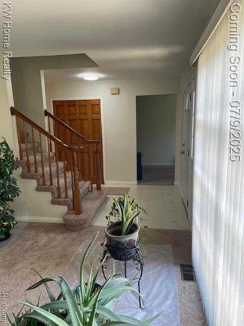 24890 Arden Park Dr, Farmington Hills, MI 48336 - hall with stairway and carpet floors