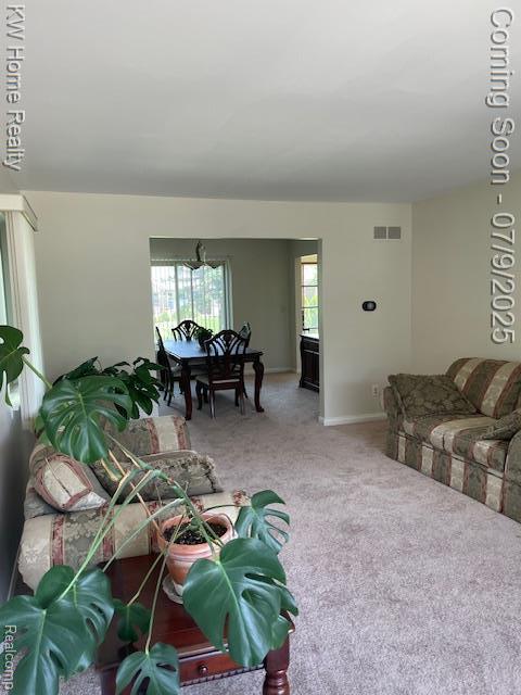 24890 Arden Park Dr, Farmington Hills, MI 48336 - living area with carpet and baseboards