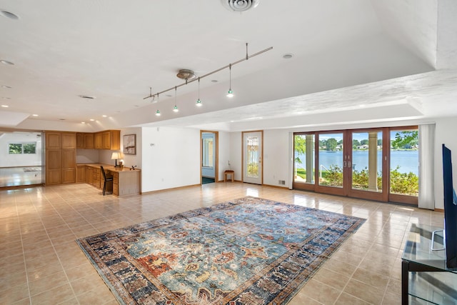 15665 Portage Rd, Vicksburg, MI 49097 - living room with light tile patterned floors and a tray ceiling