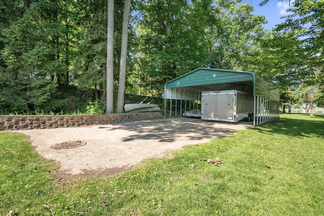15665 Portage Rd, Vicksburg, MI 49097 - view of green lawn with a detached carport and driveway