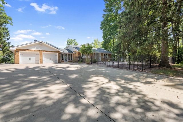 15665 Portage Rd, Vicksburg, MI 49097 - single story home featuring driveway, brick siding, and a garage