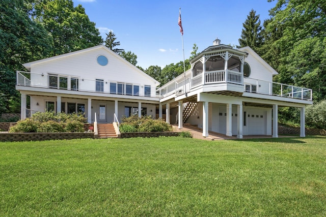15665 Portage Rd, Vicksburg, MI 49097 - rear view of property featuring a yard, stairs, an attached garage, and a gazebo