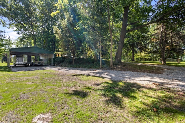 15665 Portage Rd, Vicksburg, MI 49097 - view of grassy yard with a detached carport