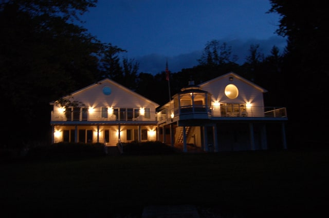 15665 Portage Rd, Vicksburg, MI 49097 - back of house at night with a balcony