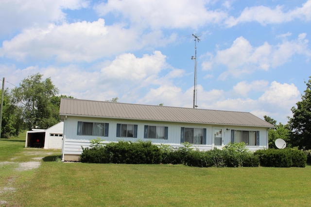 2786 Dinius Rd, Tecumseh, MI 49286 - single story home featuring a front yard, a metal roof, and board and batten siding