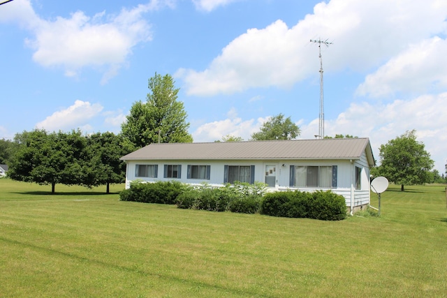 2786 Dinius Rd, Tecumseh, MI 49286 - ranch-style home with a front yard and a metal roof
