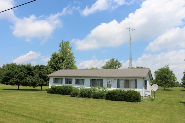 2786 Dinius Rd, Tecumseh, MI 49286 - view of front of house with a front yard and a metal roof