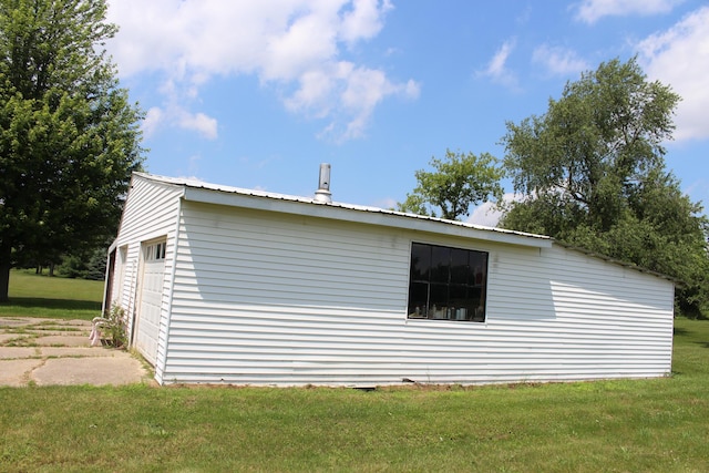 2786 Dinius Rd, Tecumseh, MI 49286 - view of property exterior with a lawn and a metal roof