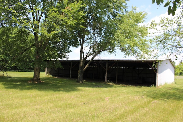 2786 Dinius Rd, Tecumseh, MI 49286 - view of grassy yard featuring a pole building, an outbuilding, and a carport