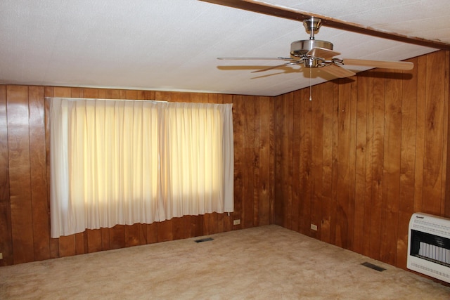 2786 Dinius Rd, Tecumseh, MI 49286 - unfurnished living room with heating unit, carpet floors, wood walls, and ceiling fan