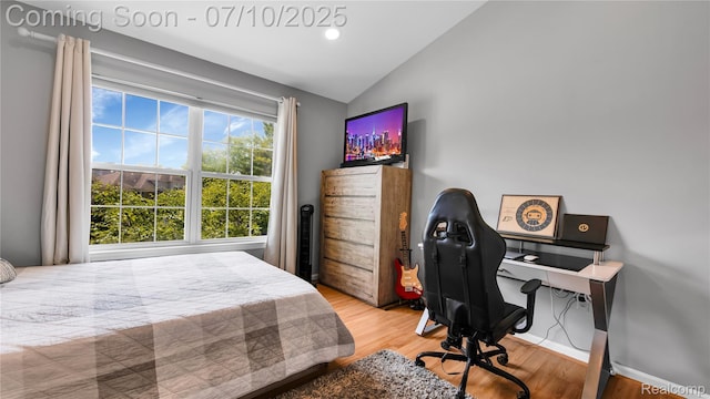 3230 Lynhurst Ct, Rochester, MI 48306 - bedroom featuring lofted ceiling, wood finished floors, and a desk