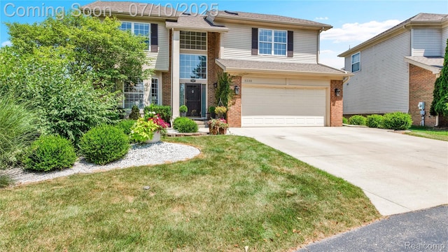 3230 Lynhurst Ct, Rochester, MI 48306 - view of front of property featuring brick siding, driveway, an attached garage, and a front lawn