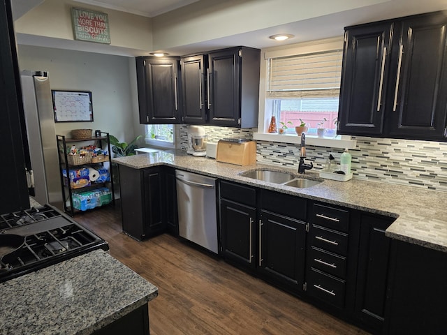 3330 Bradford St NE, Grand Rapids, MI 49525 - kitchen with dishwasher, dark cabinets, dark wood-type flooring, and ornamental molding