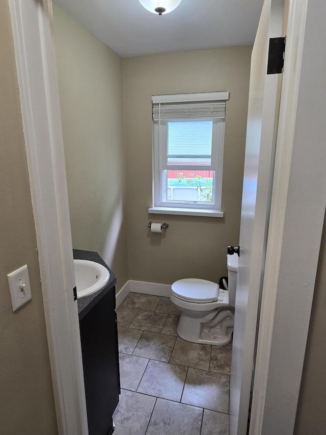 3330 Bradford St NE, Grand Rapids, MI 49525 - half bathroom with vanity and tile patterned flooring