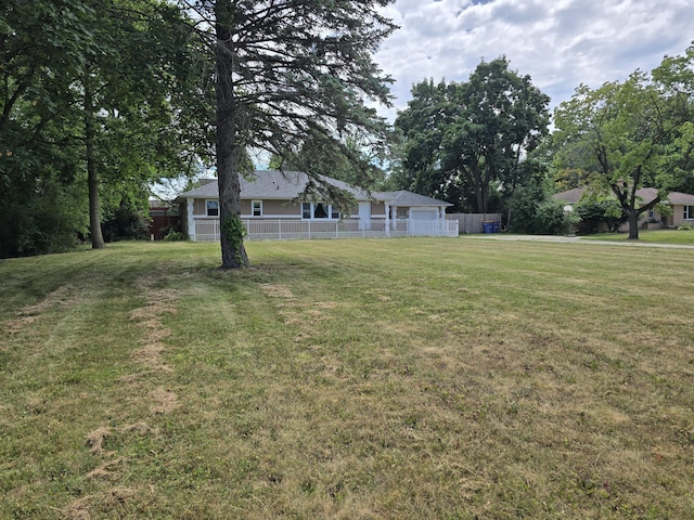 3330 Bradford St NE, Grand Rapids, MI 49525 - view of yard featuring an attached garage