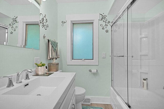 11560 Thrush Dr, Lakeview, MI 48850 - bathroom featuring vanity and bath / shower combo with glass door