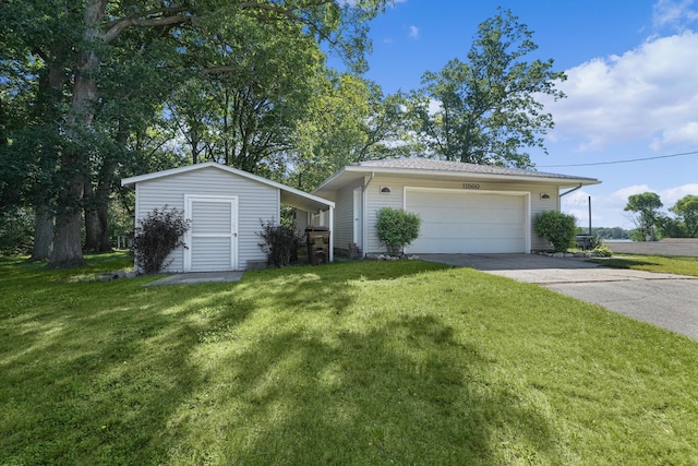 11560 Thrush Dr, Lakeview, MI 48850 - view of front of home with a front yard, an outdoor structure, concrete driveway, and an attached garage