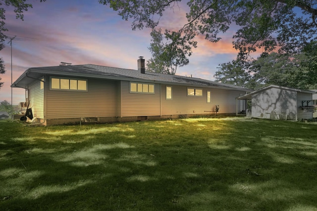 11560 Thrush Dr, Lakeview, MI 48850 - rear view of house with a yard and a chimney
