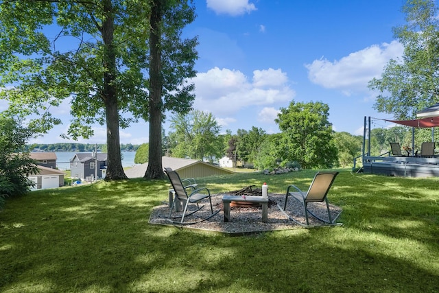 11560 Thrush Dr, Lakeview, MI 48850 - view of grassy yard with an outdoor fire pit