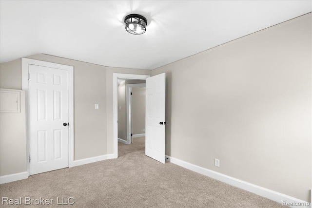 10320 Roxbury St, Detroit, MI 48224 - unfurnished bedroom with carpet floors and lofted ceiling