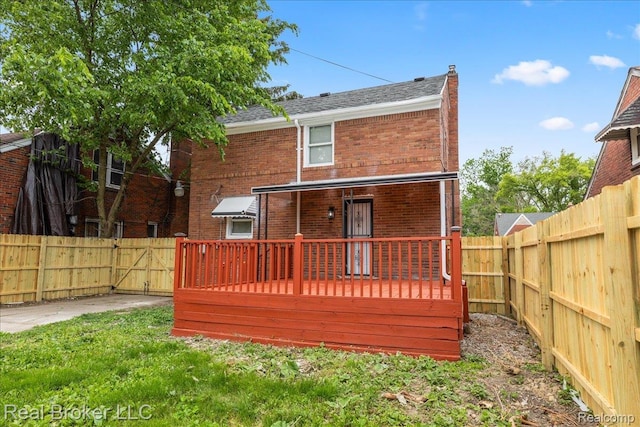 10320 Roxbury St, Detroit, MI 48224 - rear view of property with brick siding, a fenced backyard, a shingled roof, a gate, and a porch