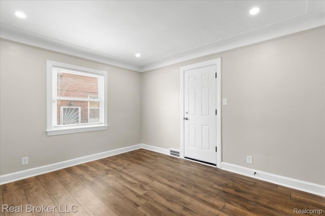 10320 Roxbury St, Detroit, MI 48224 - empty room featuring dark wood finished floors, recessed lighting, and ornamental molding