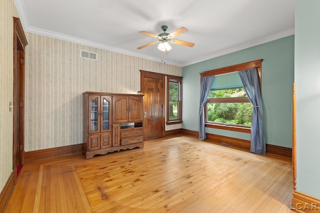305 W Chicago Blvd, Tecumseh, MI 49286 - unfurnished bedroom featuring light wood-type flooring, ornamental molding, a ceiling fan, and wallpapered walls