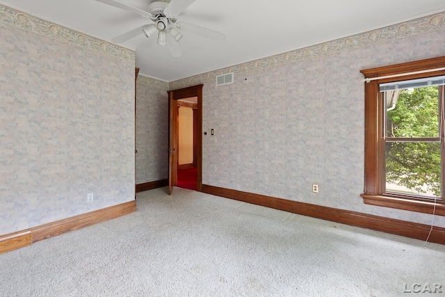 305 W Chicago Blvd, Tecumseh, MI 49286 - empty room featuring plenty of natural light, carpet flooring, and a ceiling fan