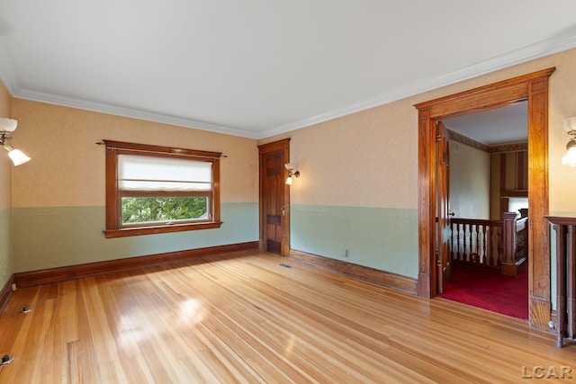 305 W Chicago Blvd, Tecumseh, MI 49286 - empty room featuring light wood finished floors and ornamental molding