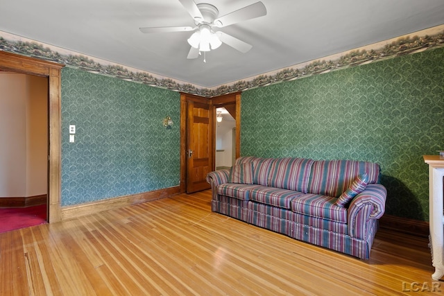 305 W Chicago Blvd, Tecumseh, MI 49286 - living room with wood finished floors, wallpapered walls, and ceiling fan