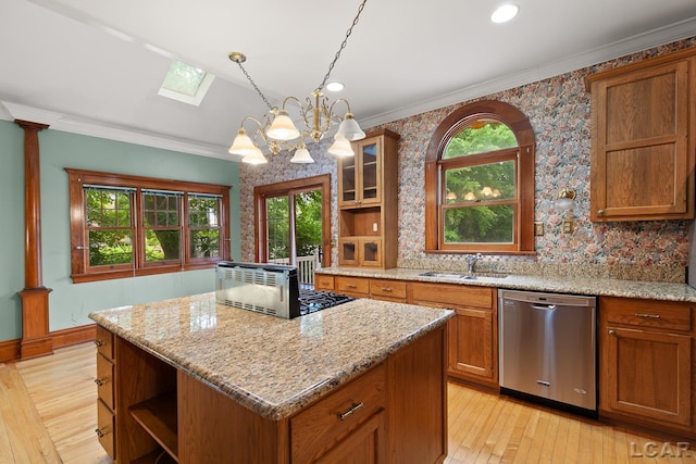 305 W Chicago Blvd, Tecumseh, MI 49286 - kitchen featuring stainless steel dishwasher, open shelves, a skylight, a kitchen island, and brown cabinetry