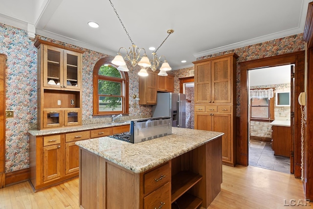 305 W Chicago Blvd, Tecumseh, MI 49286 - kitchen featuring stainless steel fridge with ice dispenser, wallpapered walls, open shelves, light wood-style flooring, and healthy amount of natural light