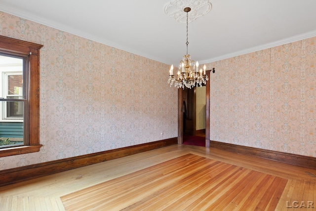 305 W Chicago Blvd, Tecumseh, MI 49286 - empty room with hardwood / wood-style floors, a chandelier, and crown molding