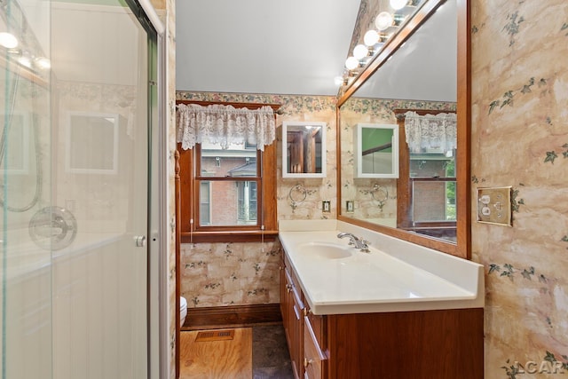 305 W Chicago Blvd, Tecumseh, MI 49286 - full bath with vanity, wallpapered walls, and a stall shower