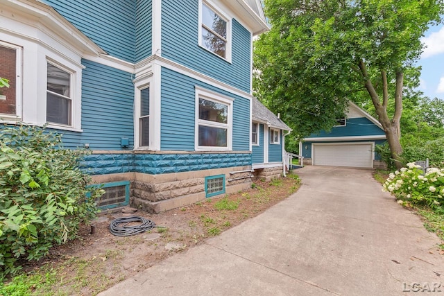 305 W Chicago Blvd, Tecumseh, MI 49286 - view of property exterior with an outbuilding and a detached garage