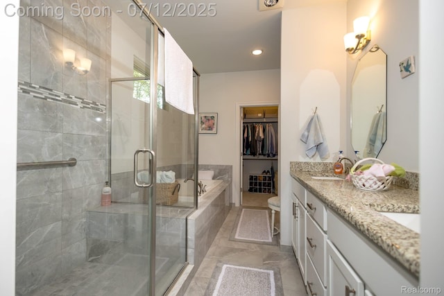 1079 Hampshire Ct, Rochester, MI 48307 - bathroom with double vanity, a shower stall, a garden tub, and a walk in closet