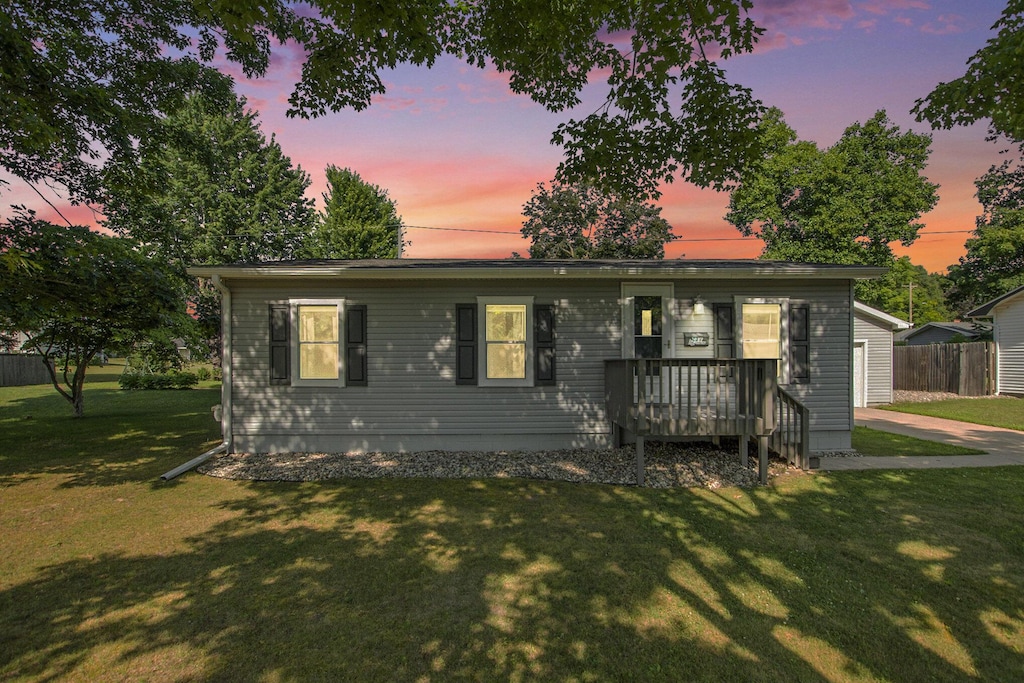107 Austin Dr, Hartford, MI 49057 - ranch-style house featuring a wooden deck