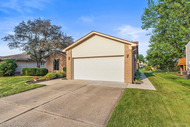 37746 Juniper Dr, Sterling Heights, MI 48310 - ranch-style home featuring brick siding, concrete driveway, a front yard, and an attached garage