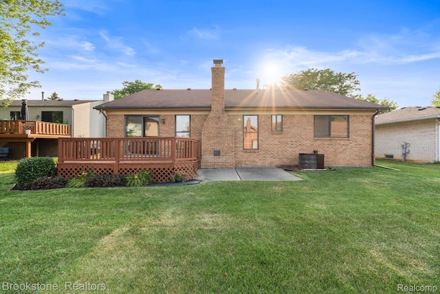 37746 Juniper Dr, Sterling Heights, MI 48310 - rear view of property featuring brick siding, a chimney, a patio, and a yard