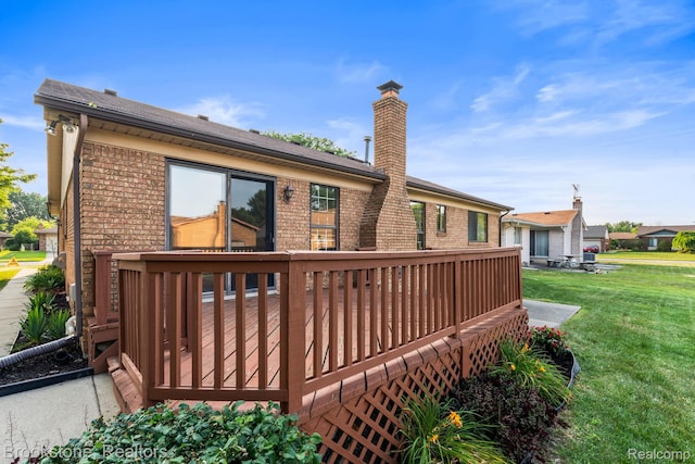 37746 Juniper Dr, Sterling Heights, MI 48310 - rear view of house with brick siding, a lawn, a deck, and a chimney