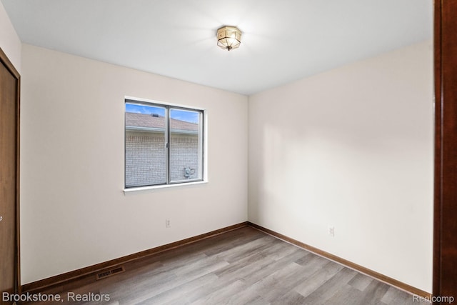 37746 Juniper Dr, Sterling Heights, MI 48310 - empty room featuring wood finished floors and baseboards