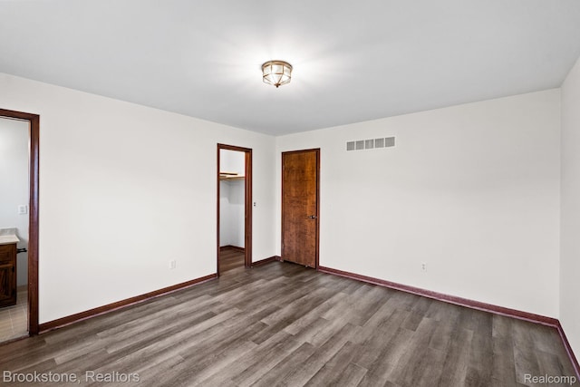 37746 Juniper Dr, Sterling Heights, MI 48310 - unfurnished bedroom featuring wood finished floors and a closet