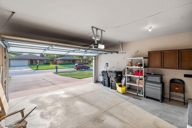 37746 Juniper Dr, Sterling Heights, MI 48310 - garage featuring a garage door opener