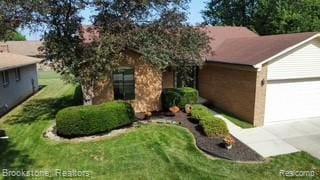 37746 Juniper Dr, Sterling Heights, MI 48310 - ranch-style home with a garage, concrete driveway, and a front yard