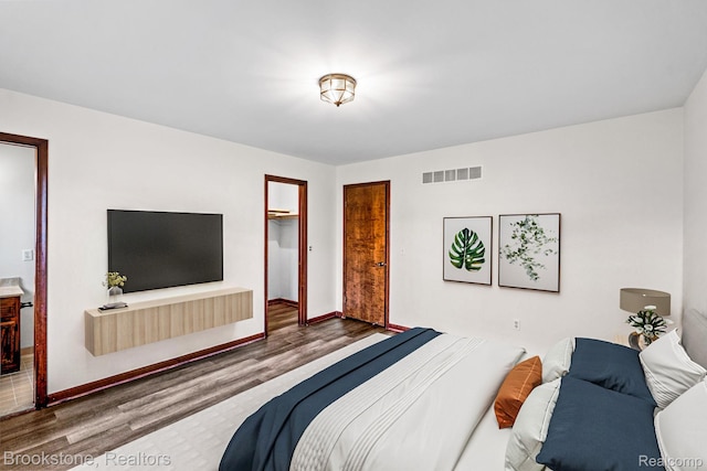 37746 Juniper Dr, Sterling Heights, MI 48310 - bedroom with wood finished floors and a closet